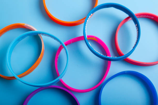 istock Colorful bracelets on blue background 1301217855