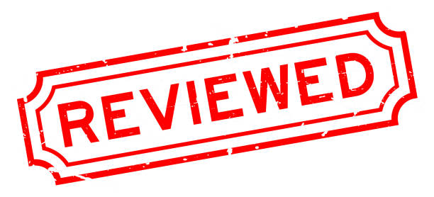 istock Grunge red reviewed word rubber seal stamp on white background 1301218176