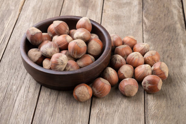 istock A group of hazelnuts in a bowl over wooden table 1301218425