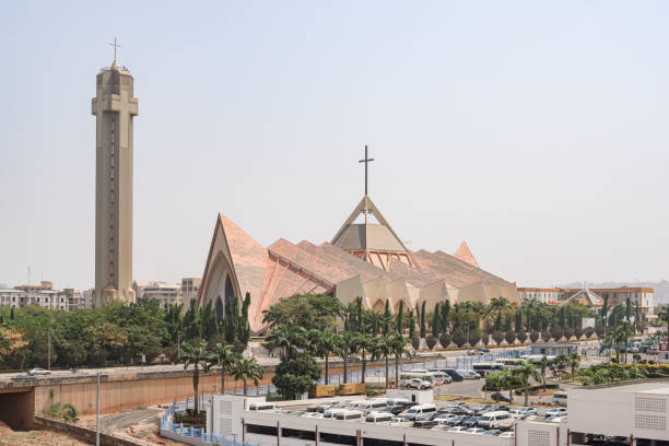 Nationa Ecumenical center in Abuja, Nigeria, West Africa National Ecumenical center, a Christian building for religious ceremonies, in modern architecture style with spiked roof and cross shaped bell tower in Abuja, Federal Capital Territory, Nigeria abuja stock pictures, royalty-free photos & images