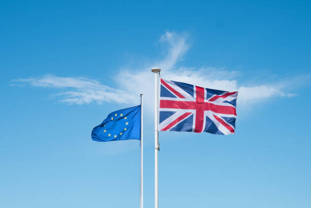 European and English flag A European and English flag that flies at the top of a mast brexit stock pictures, royalty-free photos & images