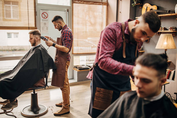 istock Busy day in barber shop 1301222215
