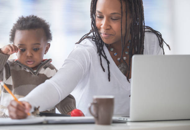 istock Multi tasking childcare and work at home 1301222828