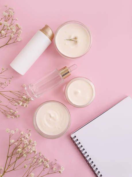 istock cream cosmetic rose flower on colored background 1301224128