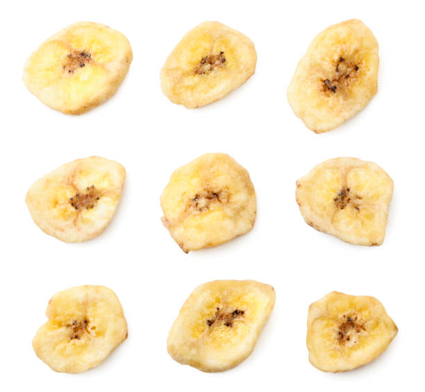 istock Banana chips set on a white isolated background. Top view 1301226592