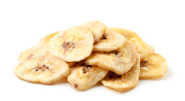 istock Banana chips heap on a white background. Isolated 1301226594