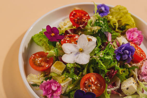 istock Beautiful healthy spring salad decorated with flowers 1301230556
