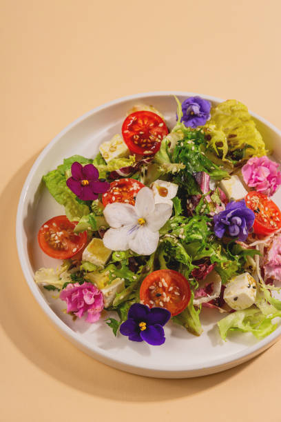 istock Beautiful healthy spring salad decorated with flowers 1301230560