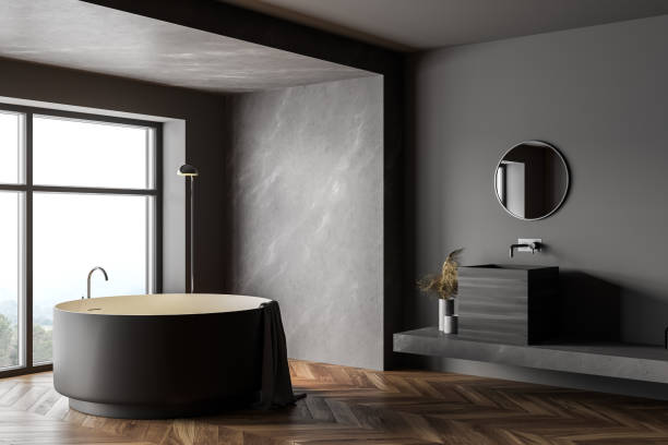 istock Marble and gray bathroom with round tub and sink 1301234370