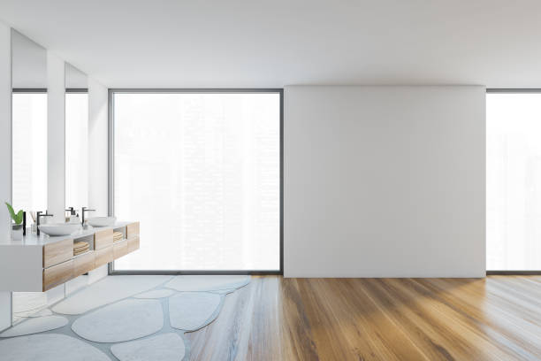 istock Mockup copy space in white and wooden bathroom with two sinks and window 1301235361