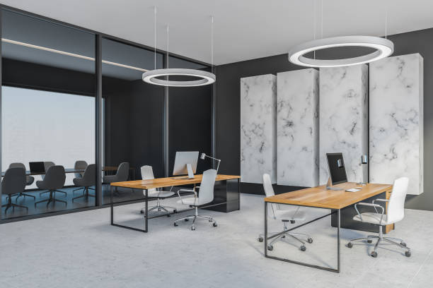 istock Grey office room with chairs and computer on wooden tables, tiled floor 1301235494