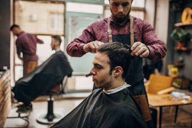 istock Busy day in barber shop 1301236358
