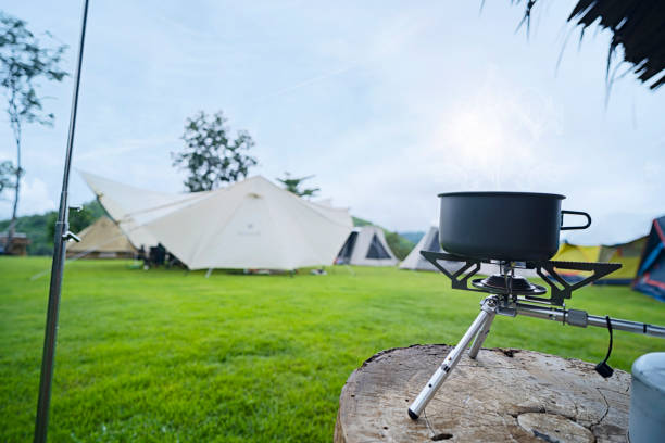 Cooking instant noodle with boiling in pitch pot during camping