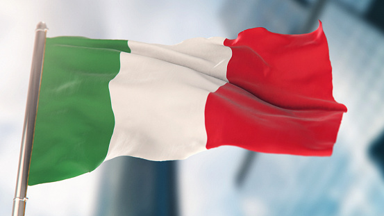 National Flag of Italy Against Defocused City Buildings