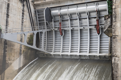 Close-up of a dam discharge during the flood period - February 2021. Detail of a discharger open during the flood period.