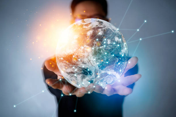 istock Businessman holding in hands with global connection concept. Energy saving concept, Elements of this image furnished by NASA 1301246126