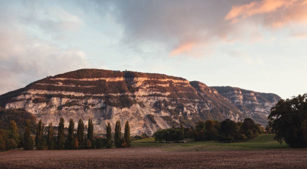 Autumnal sunset capture of the glowing cliffs of Mont Salève. Haute-Savoie, France stock photo