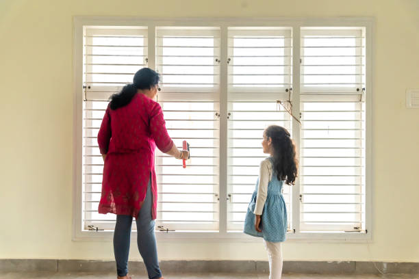 istock mother and daughter cleaning there home 1301246867