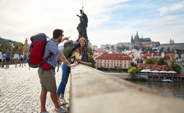 Happy tourist couple taking a selfie; Traveller lifestyle Tourist couple sightseeing in Prague; Traveller lifestyle prague stock pictures, royalty-free photos & images