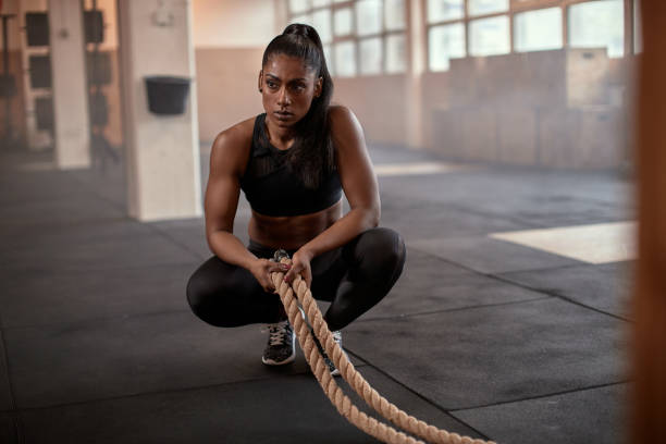 istock Fit woman tired after a rope workout 1301247680