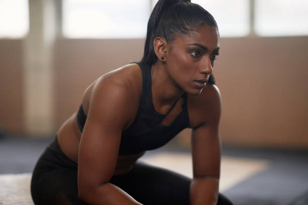 istock Young woman taking a break from working out 1301248878
