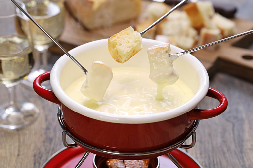 cheese fondue with bread in a special dish