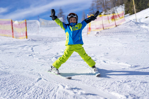 istock happy young boy having fun on ski slope 1301251022