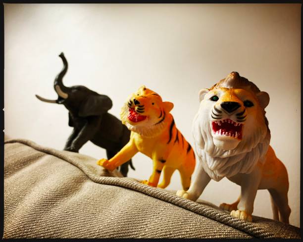 istock Toy Inexpensive Wild Animals on Sofa 1301252027