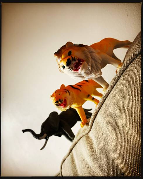 istock Toy Inexpensive Wild Animals on Sofa 1301252043