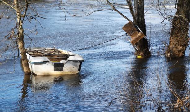 istock A chair and a boat on the river 1301252417