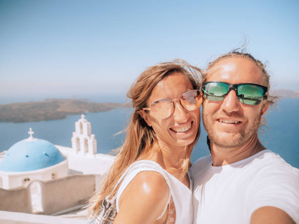 istock Tourists take selfie in Santorini 1301253998