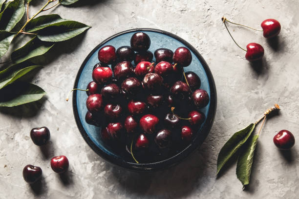 istock Sweet organic berries on a light concrete background. Top view with copy space. 1301254832