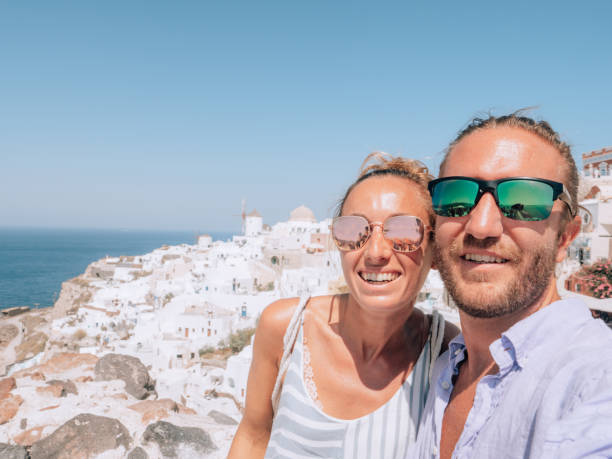 istock Tourists take selfie in Santorini 1301255916