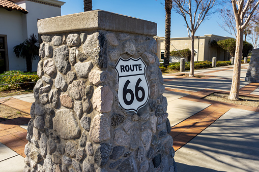 Rancho Cucamonga, CA, USA – February 6, 2021: A Route 66 sign on Foothill Boulevard in Rancho Cucamonga, California.