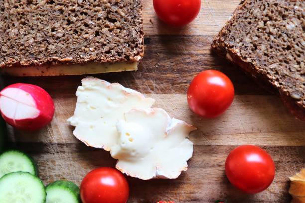 istock Close view on a healthy german breakfast with sandwiches, tomatoes and cucumbers 1301258160