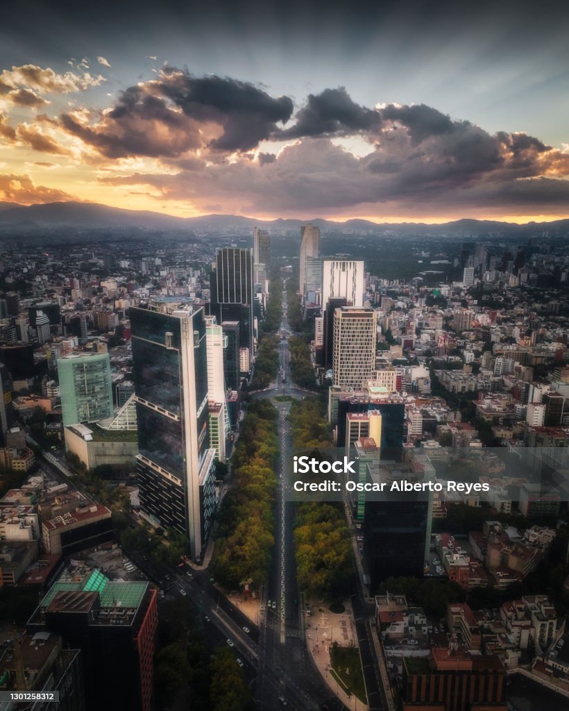 Air shot of Paseo de la Reforma during sunset in Mexico City Drone photograph of Paseo de la Reforma Avenue at the intersection with Avenida de los Insurgentes during sunset in Mexico City. Mexico City Stock Photo