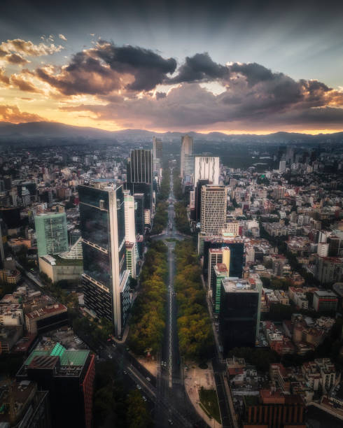 Air shot of Paseo de la Reforma during sunset in Mexico City Drone photograph of Paseo de la Reforma Avenue at the intersection with Avenida de los Insurgentes during sunset in Mexico City. mexico city stock pictures, royalty-free photos & images