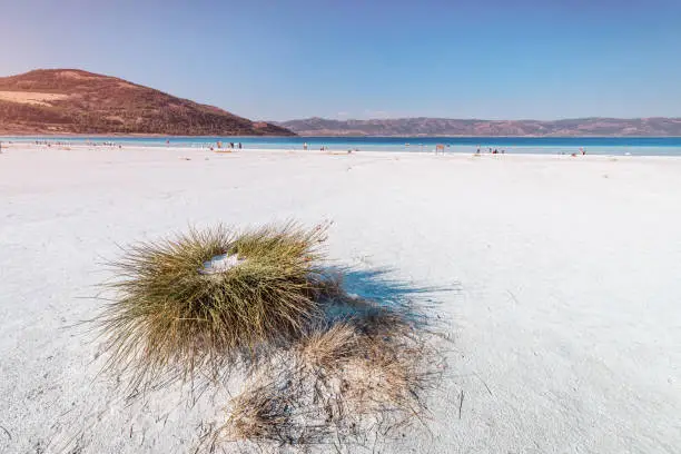 Photo of Panoramic landscape of the shore of popular tourist destination in Turkey - Salda Lake. Turkish maldives and nature wonders concept