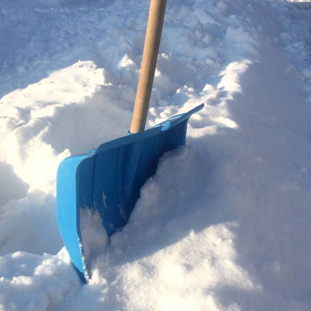 istock blue plastic shovel for snow removal, snowdrift 1301259598