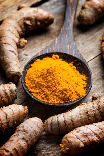 istock Curcuma longa, powder and rhizomes - complementary medicine 1301260128