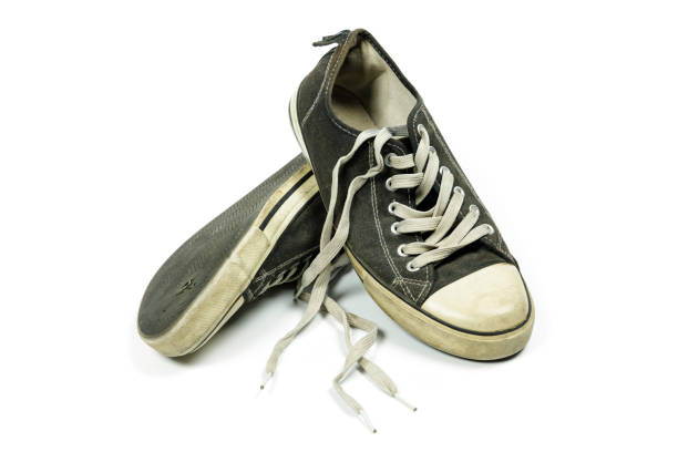 istock old, dirty trainers isolated on white 1301261624