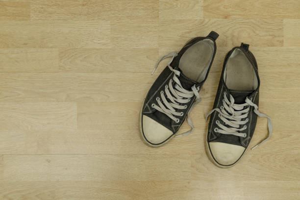 istock old, dirty trainers on a floor 1301261648