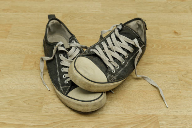 istock old, dirty trainers on a floor 1301261655
