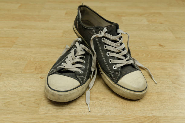 istock old, dirty trainers on a floor 1301261660