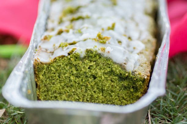Homemade green Matcha cake, in a mettalic aluminum foil box.
