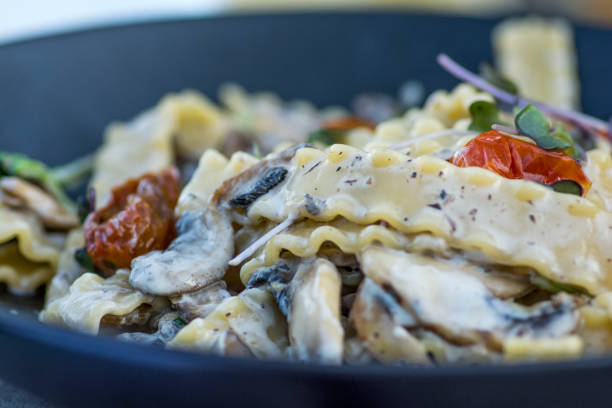 istock Mafaldine pasta with cherry tomatoes 1301262476