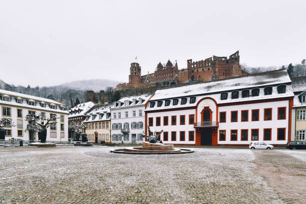 heidelberg, germany - empty town square called 'karlsplatz' with snow in winter - editorial built structure fountain town square imagens e fotografias de stock