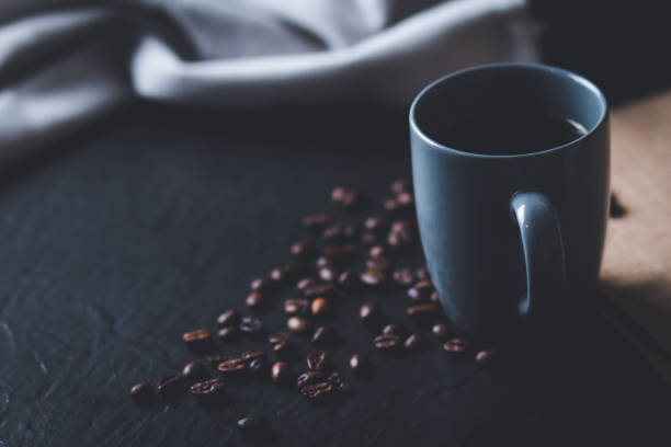 A cup of coffee and coffee beans, work from home concept