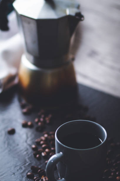 istock cup of coffee and coffee beans, work from home concept 1301263159