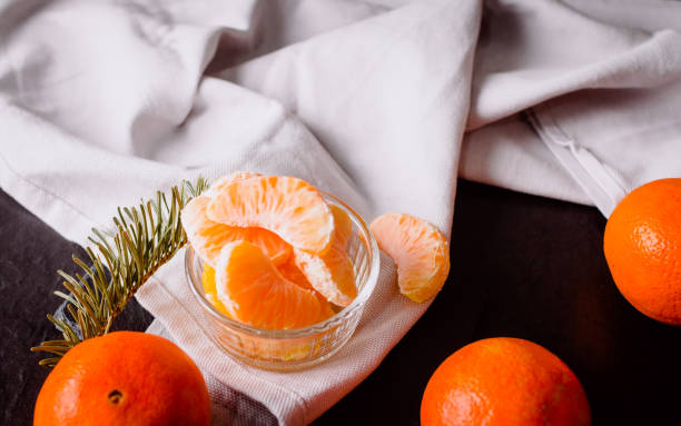 istock still life of tangerines on a black background 1301264060